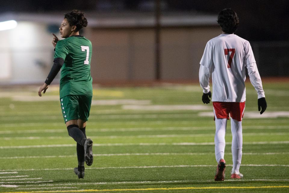 Victor Valley's Bryan Solis, left, celebrates after scoring a penalty kick to tie the match during the second half against Oxford Academy on Thursday, March 2, 2023.