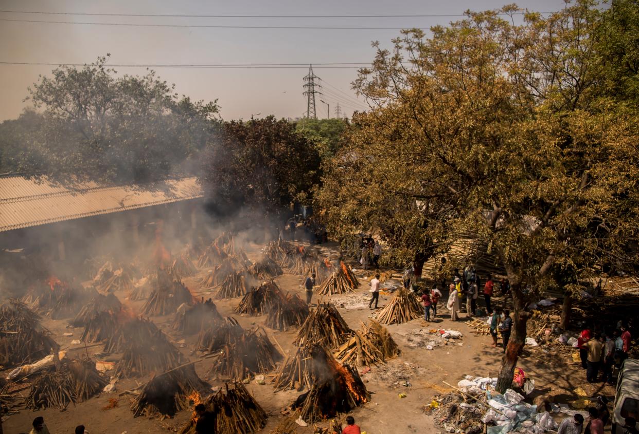 <p>A general view of multiple burning funeral pyres of patients who died of the Covid-19 coronavirus disease at a crematorium on April 24, 2021 in New Delhi, India. </p> (Photo by Anindito Mukherjee/Getty Images)