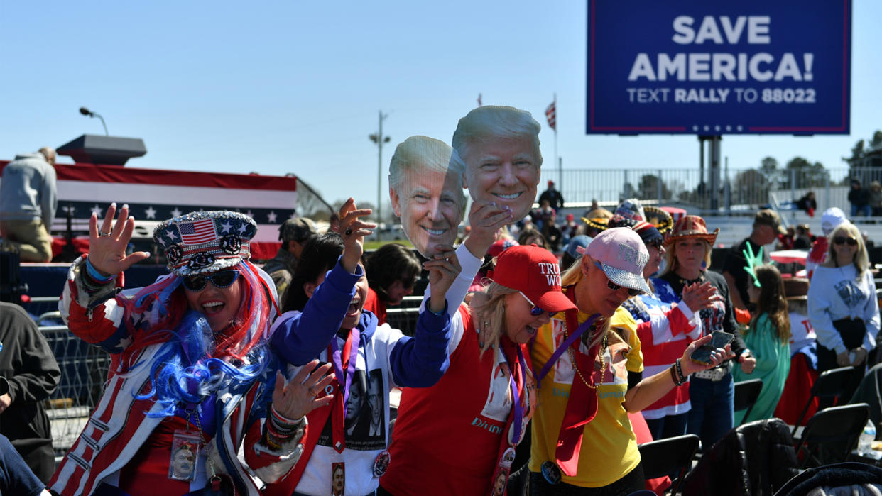 Supporters of former President Donald Trump attend a rally sponsored by Save America in Commerce, Ga., on March 26.