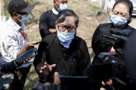 Khin Maung Zaw, center, a lawyer assigned by the National League for Democracy party to represent deposed Myanmar leader Aung San Suu Kyi, speaks to journalists outside the Zabuthiri Township Court in Naypyitaw, Myanmar, Myanmar, Monday, March 1, 2021. Police in Myanmar’s biggest city of Yangon on Monday fired tear gas at defiant crowds who returned to the streets to protest the military’s seizure of power a month ago, despite reports that security forces had killed at least 18 people around the country a day earlier. (AP Photo)