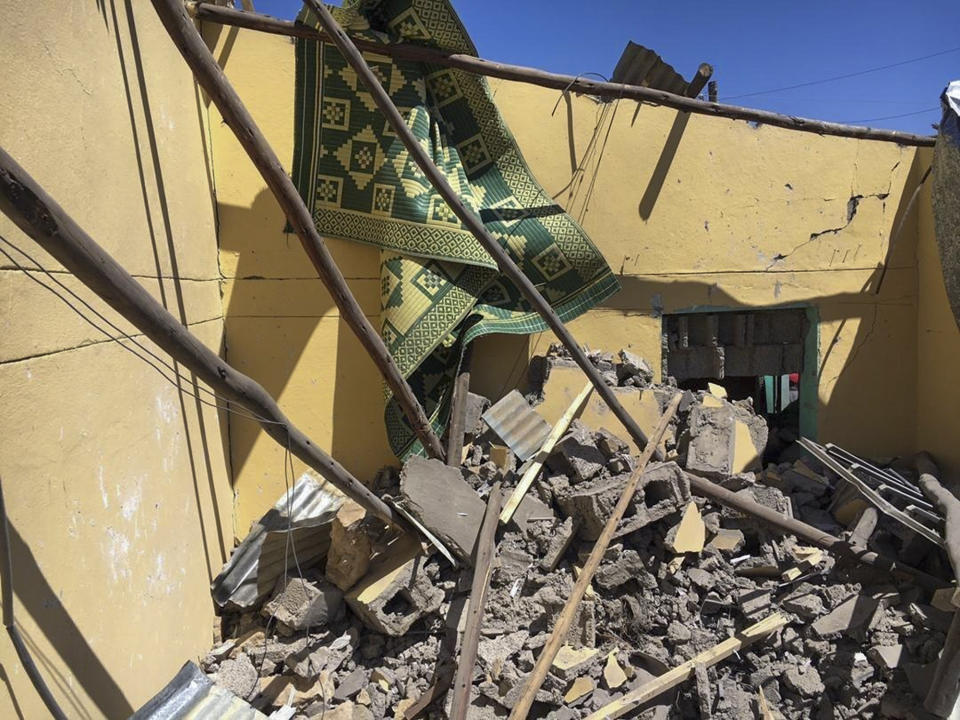 Rubble from a destroyed building at the scene of an airstrike in Mekele, in the Tigray region of northern Ethiopia Thursday, Oct. 28, 2021. An Ethiopian government spokesman says a new airstrike has hit Mekele, targeting a site used by rival Tigray forces to make and repair weapons, while a Tigray spokesman instead says it struck a "civilian residence" killing six people and wounding more than 20. (AP Photo)