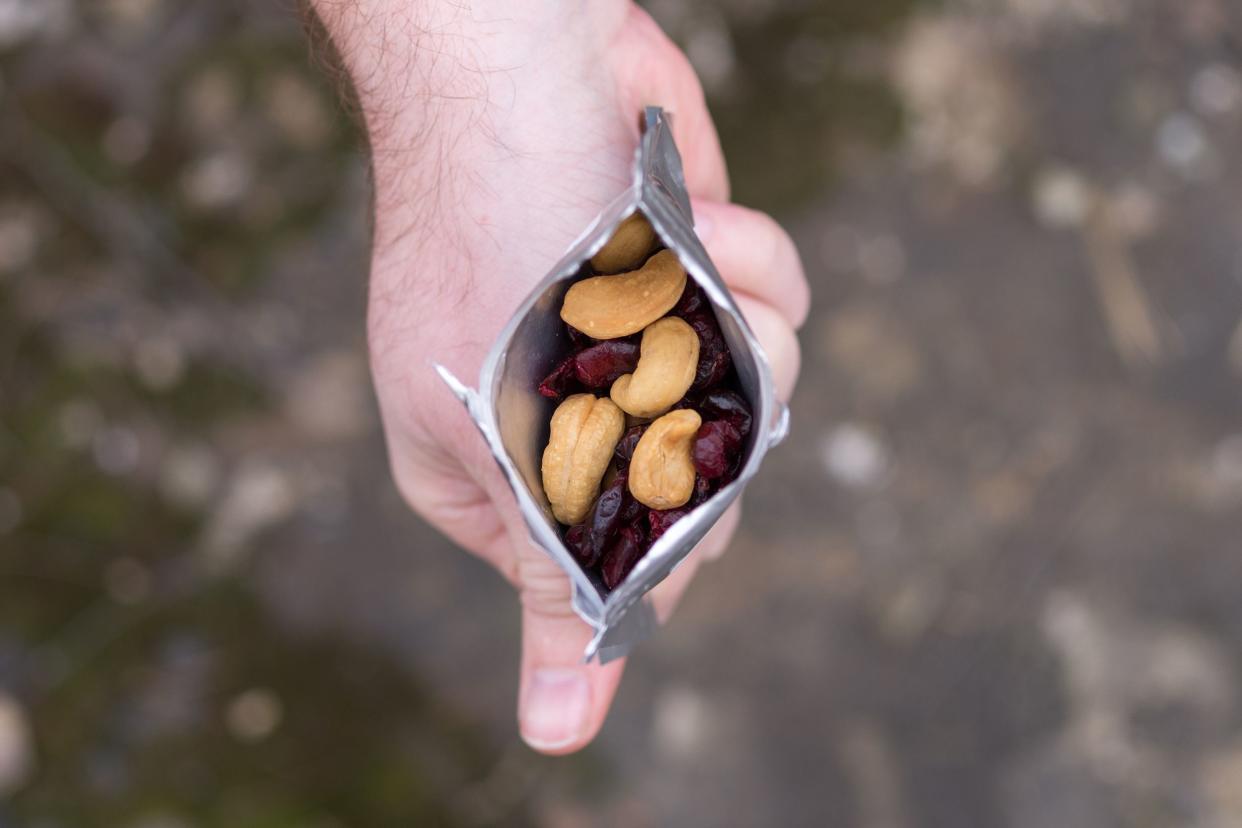 hand holding nut snack pack