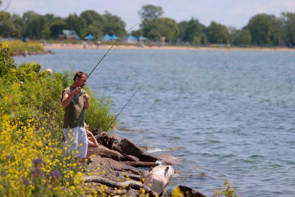 The shoreline of Lake St. Clair at the Metropark in Harrison Township on Wednesday, July 19, 2023 only had a couple  of people fishing but come the weekend this area has plenty of those fishing from shore and many more on boats on the popular lake. 