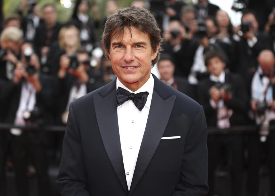 Tom Cruise posa al llegar al estreno de "Top Gun: Maverick" en la 75ta edición del Festival Internacional de Cine de Cannes, en el sur de Francia, el miércoles 18 de mayo de 2022. (Foto por Vianney Le Caer/Invision/AP)