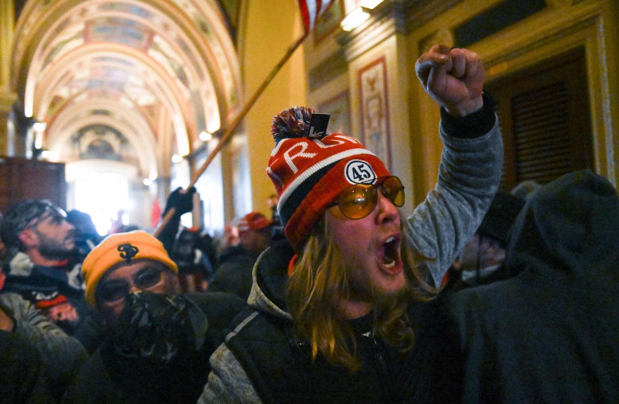 Supporters of US President Donald Trump protest inside the US Capitol on January 6, 2021, in Washington, DC. - Demonstrators breeched security and entered the Capitol as Congress debated the a 2020 presidential election Electoral Vote Certification. (Photo by ROBERTO SCHMIDT / AFP) (Photo by ROBERTO SCHMIDT/AFP via Getty Images) ORG XMIT: 0 ORIG FILE ID: AFP_8YA8PE.jpg