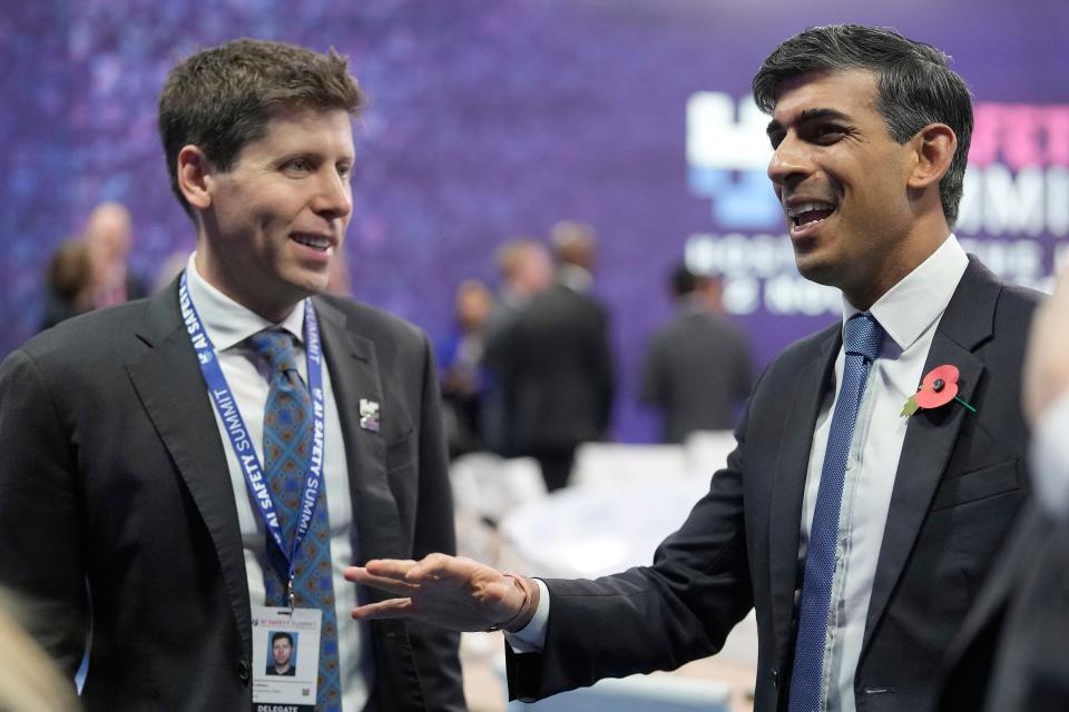 Sam Altman and Rishi Sunak stand together at a conference.