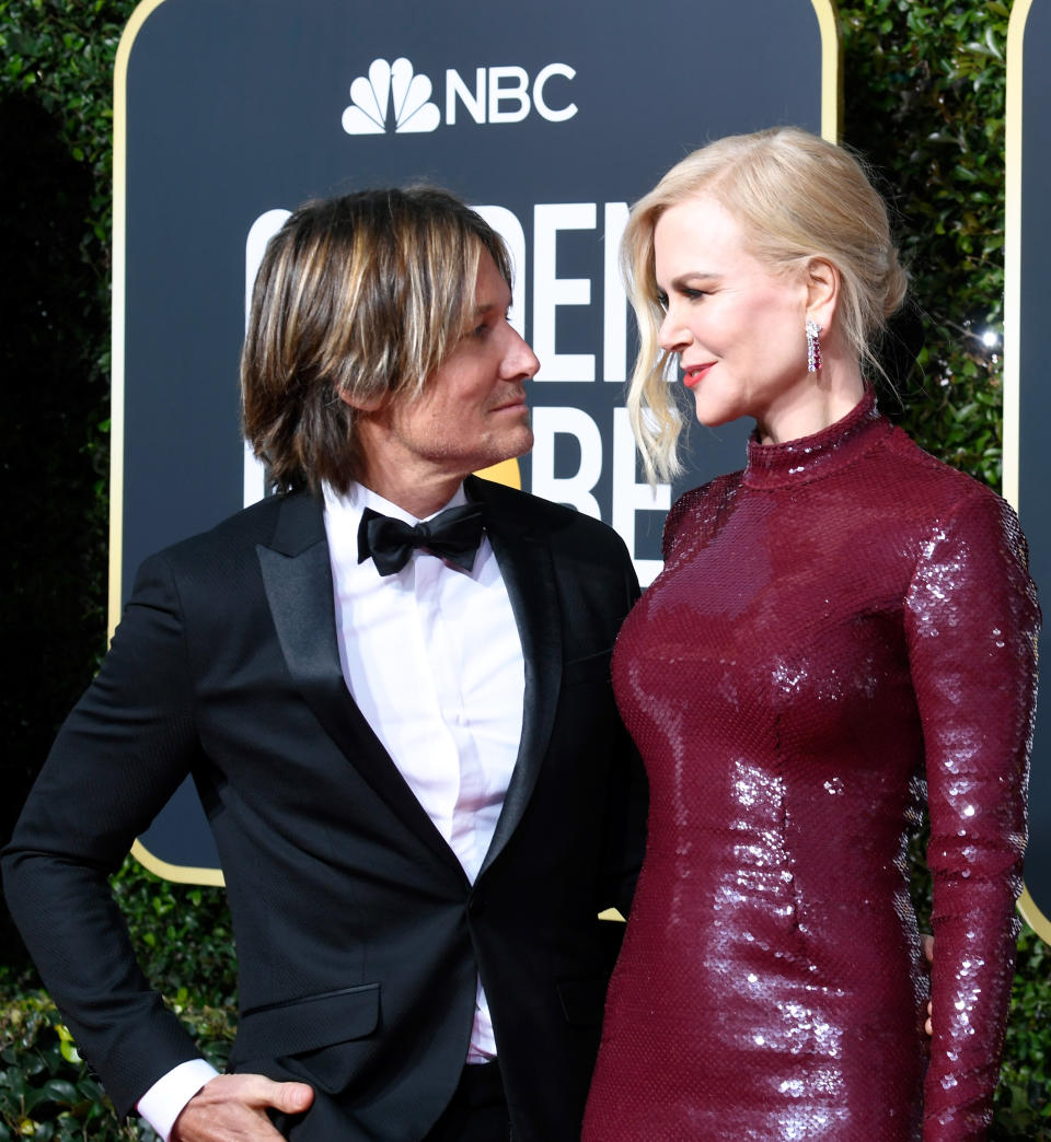 The Australian actress stunned in a skintight burgundy gown by Michael Kors on the night, as she posed alongside her husband, Keith Urban. Photo: Getty Images