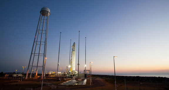 An Orbital Sciences-built Antares rocket stands atop its launch pad at sunrise on Oct. 26, 2014, one day ahead of a planned evening launch from NASA's Wallops Flight Facility on Wallops Island, Virginia. The rocket and its Cygnus cargo ship wil