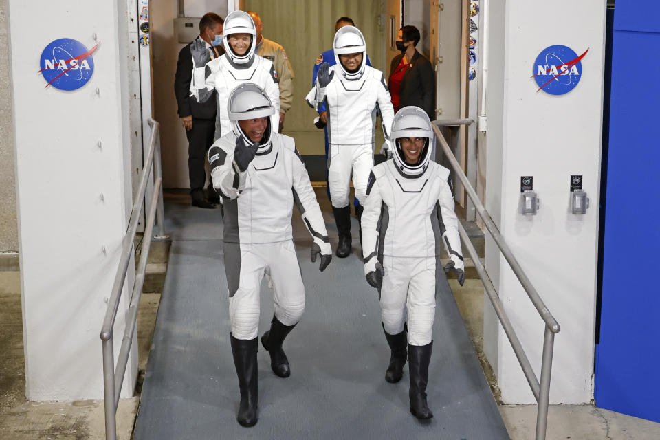 Danish astronaut Andreas Mogensen, front left, NASA astronaut Jasmin Moghbeli, front right, Russian cosmonaut Konstantin Borisov, back left, and Japanese astronaut Satoshi Furukawa leave the Operations and Checkout Building before heading to the launch pad to board the SpaceX Falcon 9 rocket on a mission to the International Space Station, at Kennedy Space Center in Cape Canaveral, Fla., early Saturday, Aug. 26, 2023. (AP Photo/Terry Renna)