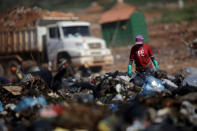 A person works at 'Lixao da Estrutural', Latin America's largest rubbish dump, in Brasilia, Brazil, January 19, 2018. REUTERS/Ueslei Marcelino