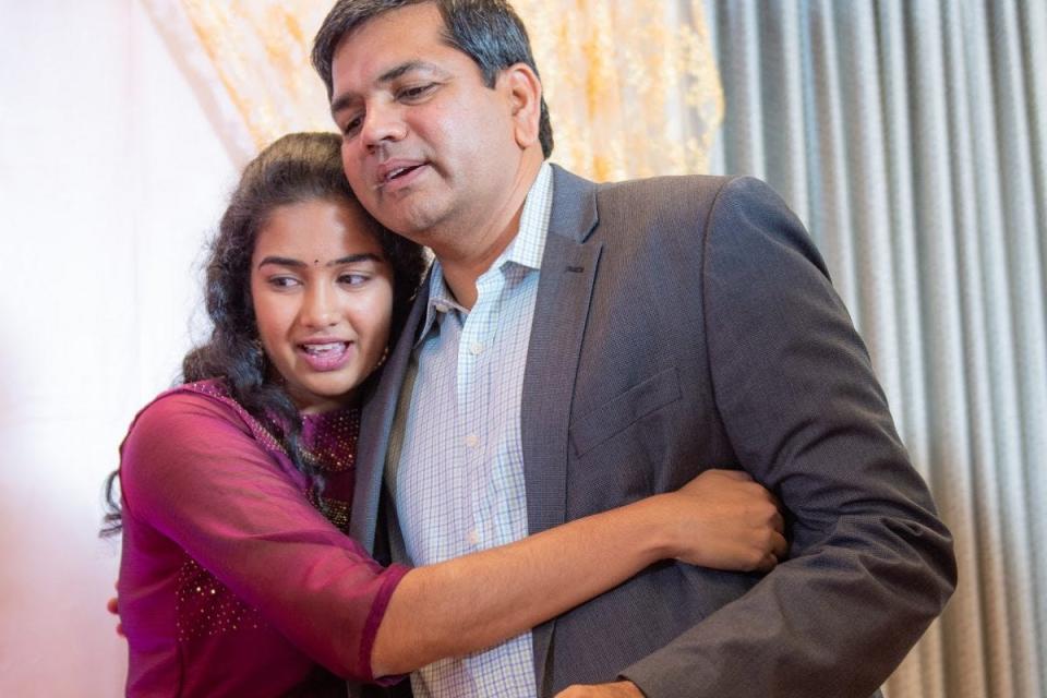 Clocr CEO and co-founder Apoorva Chintala, 21, hugs her dad, Sree Chintala, who's also the CTO. The idea for Clocr arose after Sree was thrust into the role of executor after his father died in India and he was left to handle the estate from Texas.