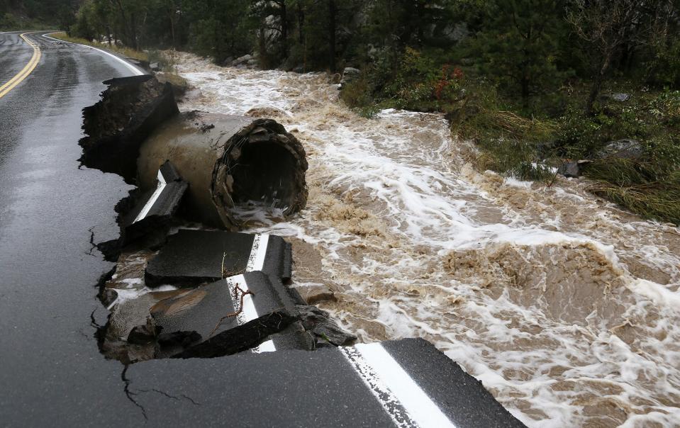 A section of Highway 72 is missing after a flash flood tore through Coal Creek near Golden