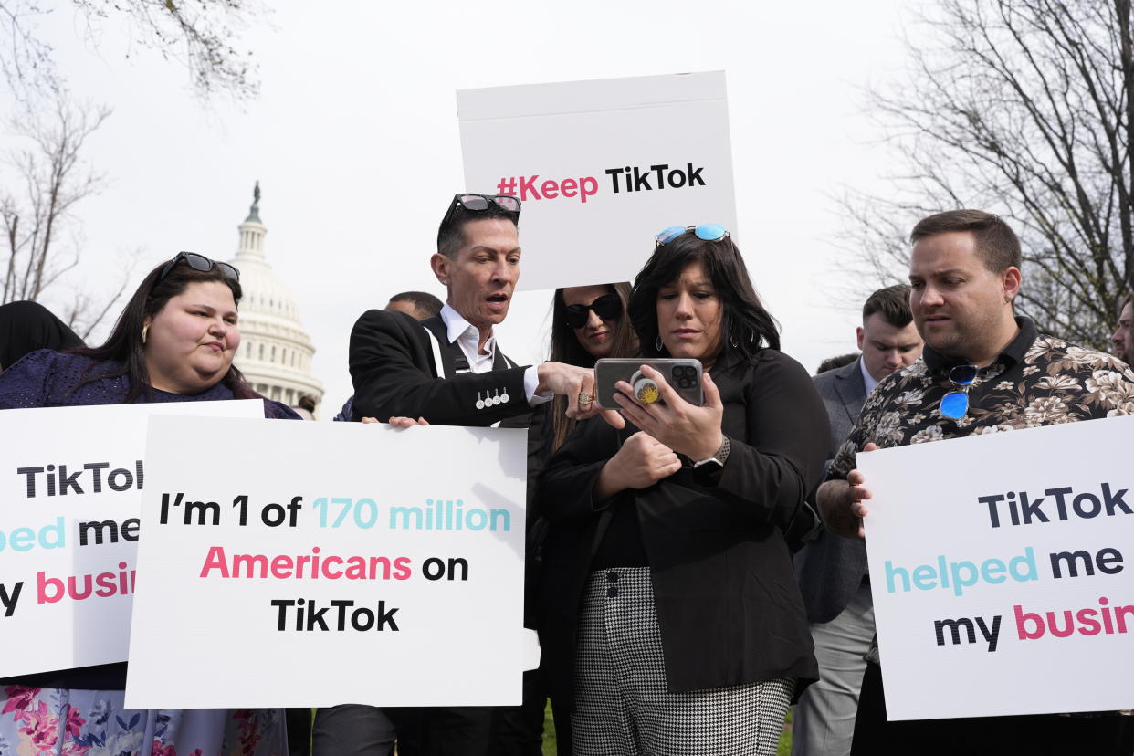 Devotees of TikTok gather at the Capitol in Washington, as the House passed a bill that would lead to a nationwide ban of the popular video app if its China-based owner doesn't sell, Wednesday, March 13, 2024. Lawmakers contend the app's owner, ByteDance, is beholden to the Chinese government, which could demand access to the data of TikTok's consumers in the U.S. (AP Photo/J. Scott Applewhite)