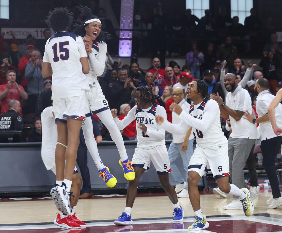 StepinacÕs Boogie Fland celebrates with teammates after defeating Nazareth in the CHSAA city championship at Fordham University March 10, 2024.