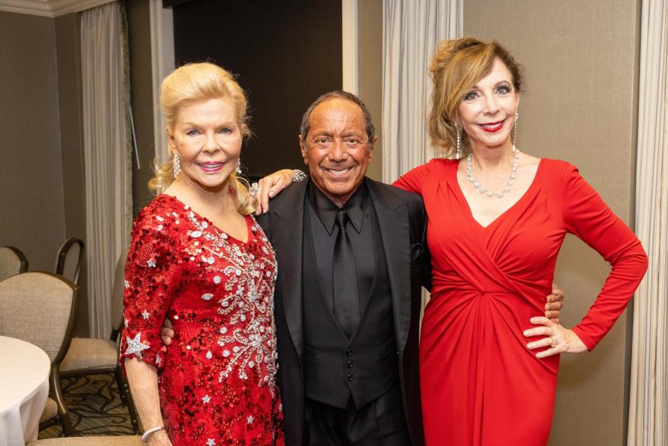 Lois Pope with Paul Anka and Rita Rudner at the 2023 Lady in Red Gala. The 2024 event will be March 17 at The Breakers.