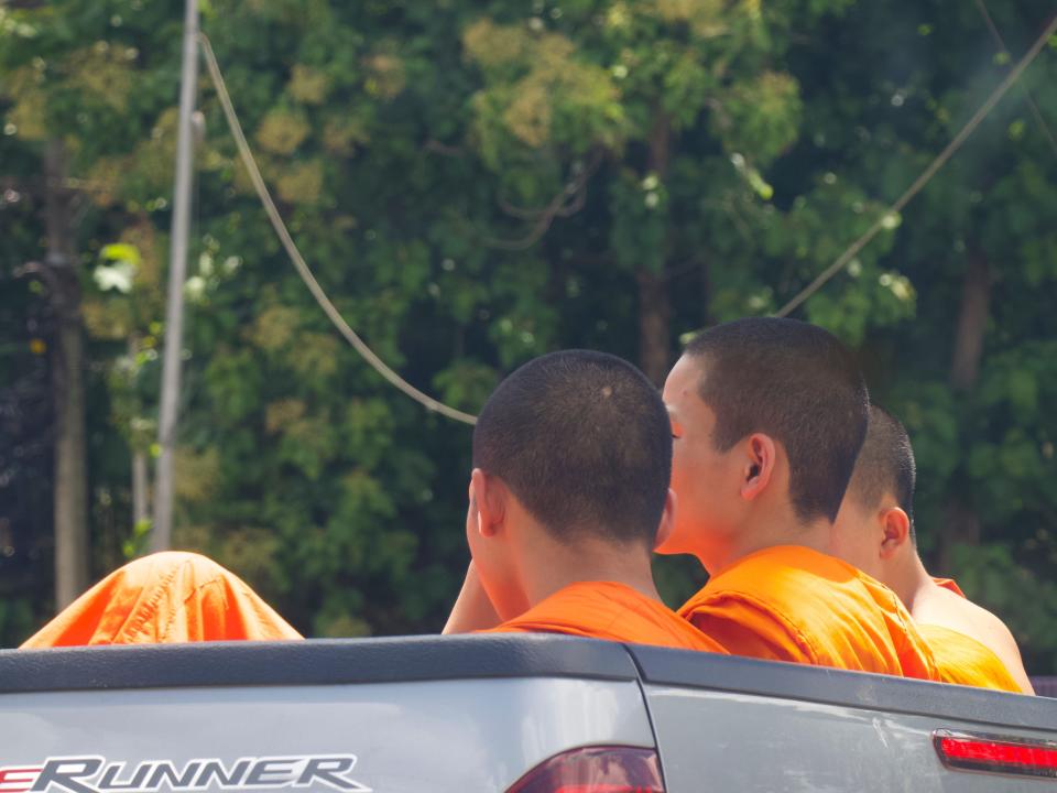 Young monks with shaved heads in Chiang Mai.