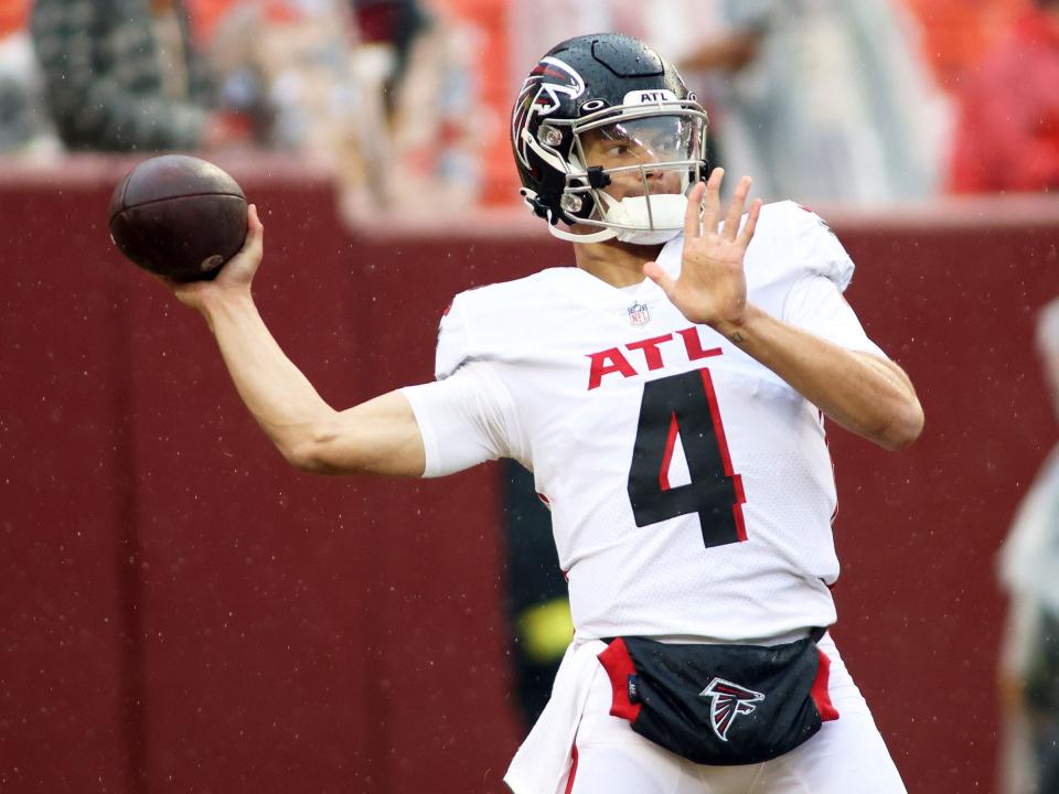 Desmond Ridder throws before a game against the Washington Commanders.