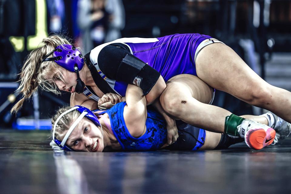 Bronson's Mackenna Webster takes the big steps needed for a pin fall win in the MHSAA State Finals. Webster took third place at 140 pounds in the girls state finals