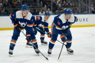 New York Islanders' Mike Reilly (2), Casey Cizikas (53) and Mathew Barzal (13) await a faceoff during the first period of the team's NHL hockey game against the Nashville Predators in Elmont, N.Y., Saturday, April 6, 2024. (AP Photo/Peter K. Afriyie)