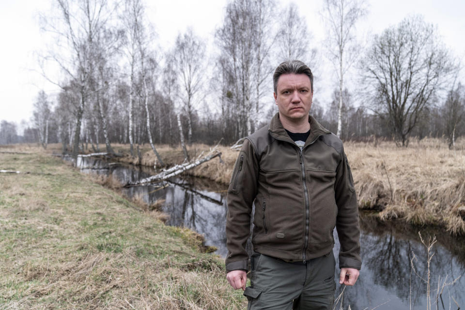 Denis Vishnevskiy, chief of the unit of the Chernobyl Radiation and Ecological Biosphere Reserve, speaks during his interview with the Associated Press at the Chernobyl exclusion zone, Ukraine, Tuesday, April 13, 2021. "This is a gigantic territory in which we keep a chronicle of nature," said Denis Vishnevskiy, 43, who has been observing nature in the reserve for the past 20 years. "The exclusion zone is not a curse, but our resource." The vast and empty Chernobyl Exclusion Zone around the site of the world’s worst nuclear accident is a baleful monument to human mistakes. Yet 35 years after a power plant reactor exploded, Ukrainians also look to it for inspiration, solace and income. (AP Photo/Evgeniy Maloletka)