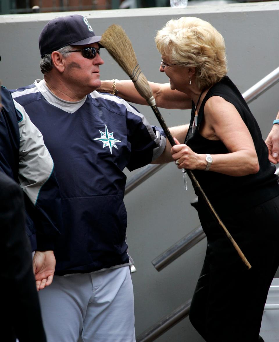 Mariners manager Mike Hargrove receives a hug from his wife Sharon following a win over the Toronto Blue Jays, July 1, 2007, in Seattle. It was Hargrove's last game as manager after he announced he was resigning before the game.