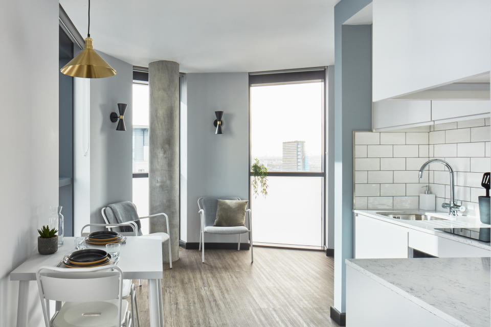 A kitchenette and dining area in a unit at The Collective Canary Wharf.