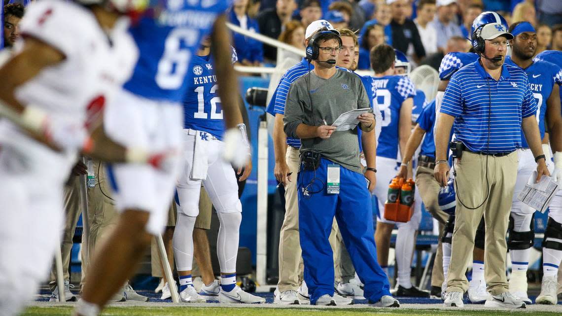 Kentucky offensive coordinator Rich Scangarello, center, and UK offensive line coach Zach Yenser, right, both came to Kentucky from the San Francisco 49ers’ coaching staff.