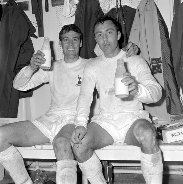 Jimmy Greaves, right, and Mike England celebrate winning the 1967 FA Cup with a pint of milk in the dressing room at Wembley