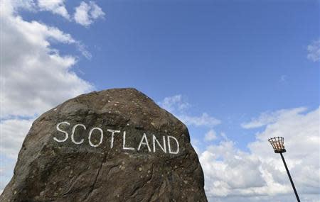 A marker stone is seen at Carter Bar in the Scottish Borders August 22, 2013. REUTERS/Toby Melville