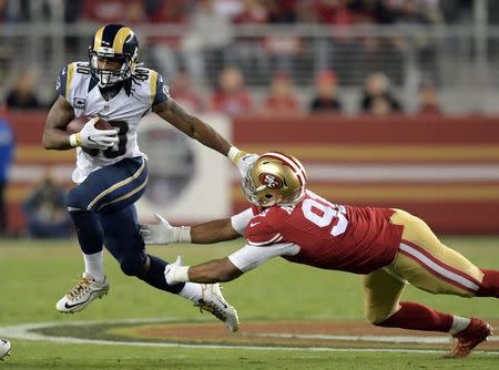 Sep 12, 2016; Santa Clara, CA, USA; Los Angeles Rams running back Todd Gurley (30) is defended by San Francisco 49ers defensive end Arik Armstead (91) during a NFL game at Levi's Stadium. Mandatory Credit: Kirby Lee-USA TODAY Sports