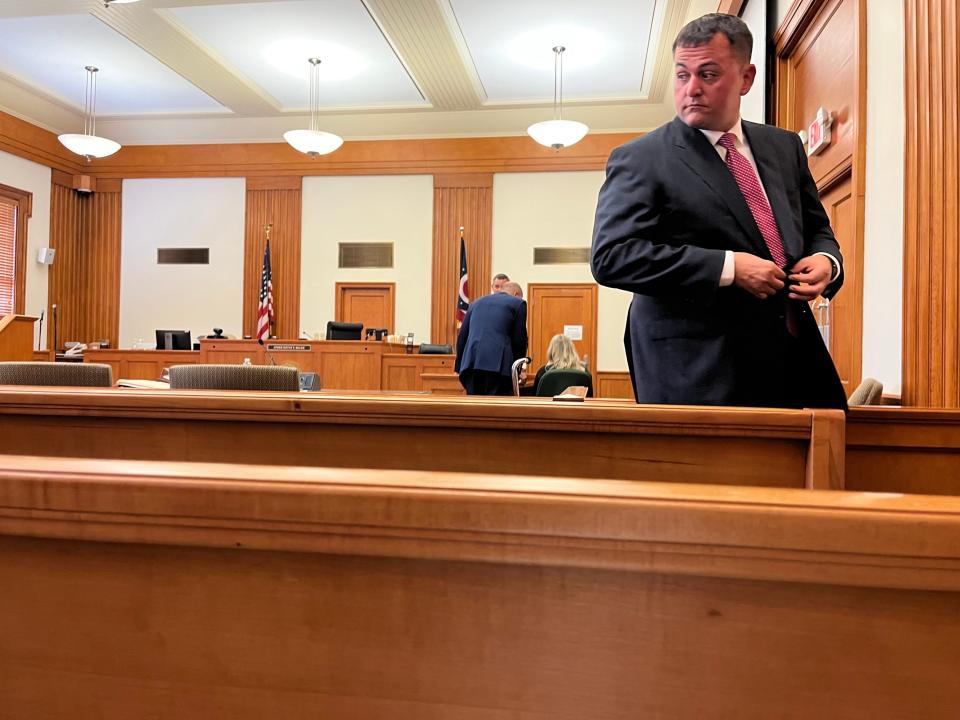 Jacob Bumpass, accused of leaving the body of Northern Kentucky teenager Paige Johnson in a wooded area in 2010 after her disappearance, stands in a courtroom in Clermont County. Johnson was 17. Her remains were found more than a decade later.