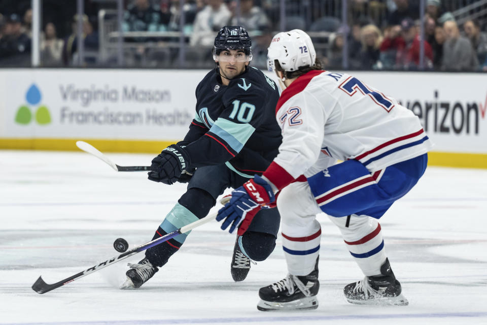 Seattle Kraken forward Matty Beniers skates against Montreal Canadiens defenseman Arber Xhekaj during the second period of an NHL hockey game Tuesday, Dec. 6, 2022, in Seattle. (AP Photo/Stephen Brashear)