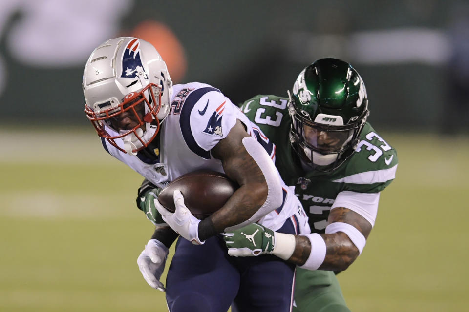 FILE- In this Oct. 21, 2019, file photo, New York Jets strong safety Jamal Adams (33) tackles New England Patriots' James White (28) during the first half of an NFL football game in East Rutherford, N.J. The Jets traded disgruntled star safety Adams to the Seattle Seahawks on Saturday, July 25, 2020, splitting with a gifted player whose relationship with the franchise quickly deteriorated because of a contract dispute. (AP Photo/Bill Kostroun, File)