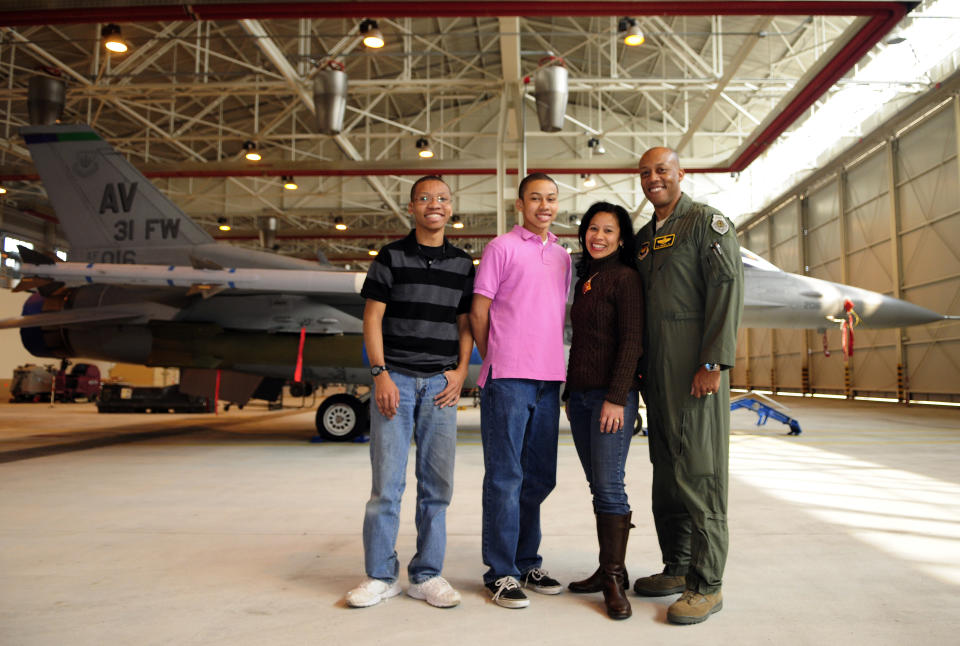 In this image provided by the U.S. Air Force, Brig. Gen. CQ Brown, Jr.,, his wife Sharene Brown, and sons, Sean and Ross, pose for a photo at the 31st Fighter Wing, Aviano Air Base, Italy, on March 11, 2011. Brown commanded the 31st Fighter Wing at Aviano Air Base from June 2009 to April 2011. (Airman 1st Class Katherine Windish/U.S. Air Force via AP)