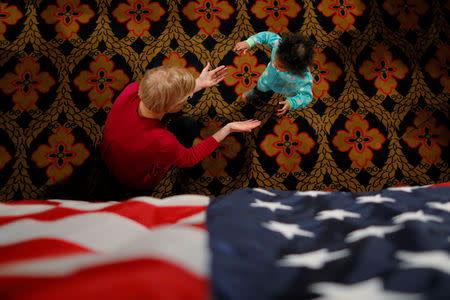 U.S. Senator Elizabeth Warren (D-MA) greets an young girl at an Organizing Event in Sioux City, Iowa, U.S., January 5, 2019. REUTERS/Brian Snyder