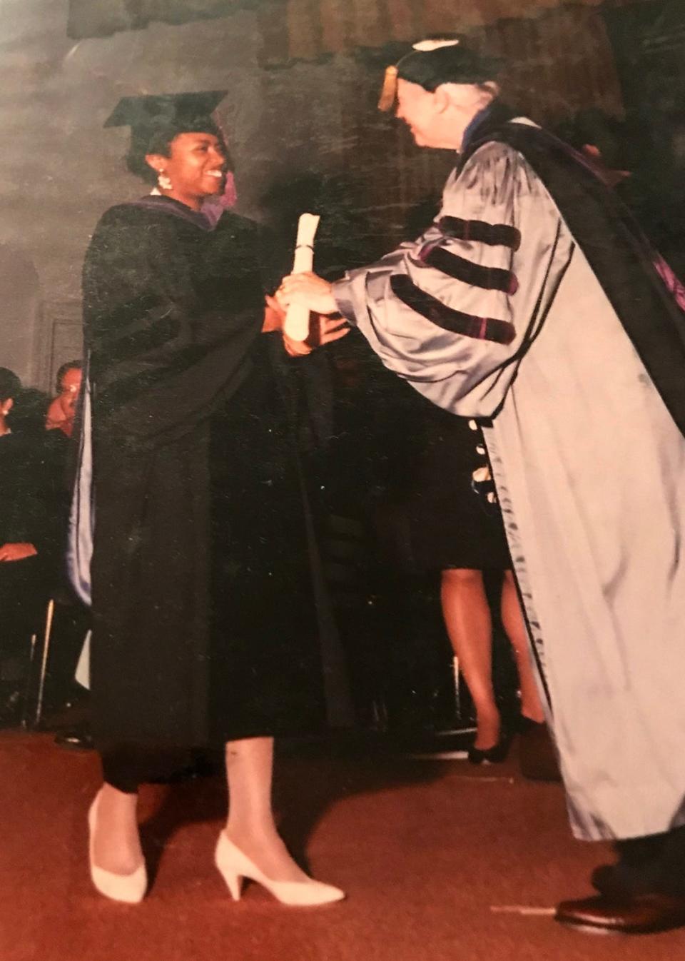 Fifteen years after coming face-to-face with her idol Angela Davis at Cobo Hall, Detroiter Opolla Brown proudly received her law degree from the Lansing campus of the Thomas M. Cooley Law School (Class of 1994). 