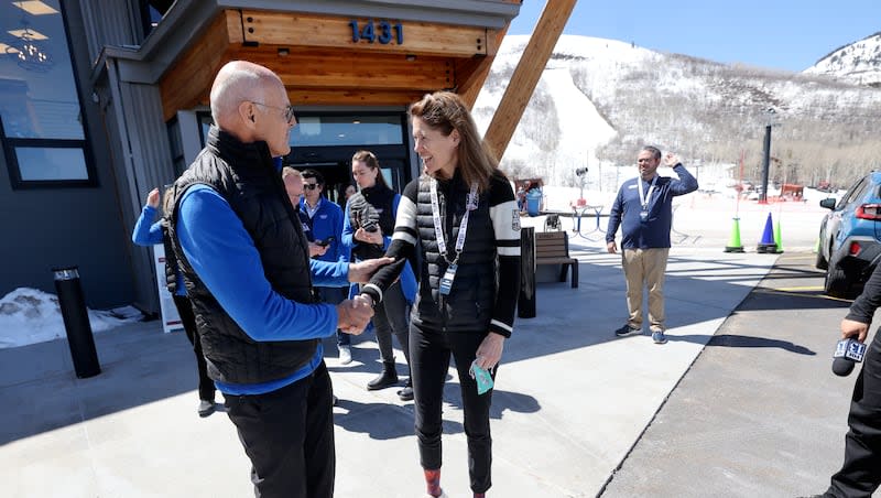 Karl Stoss, Future Host Commission for the Olympic Winter Games chair, shakes hands with Sophie Goldschmidt, U.S. Ski & Snowboard president and CEO, as members of the International Olympic Committee’s Future Host Commission, IOC and U.S. Olympic & Paralympic leaders visit Park City Mountain in consideration for the 2034 Games outside of the McGrath Mountain Center in Park City on Thursday, April 11, 2024.