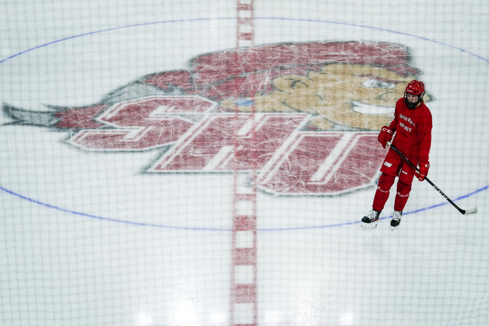 A member of the women's hockey team skates at the newly constructed NCAA college hockey Martire Family Arena on the campus of Sacred Heart University in Fairfield, Conn., Monday, Jan 9, 2023. (AP Photo/Bryan Woolston)