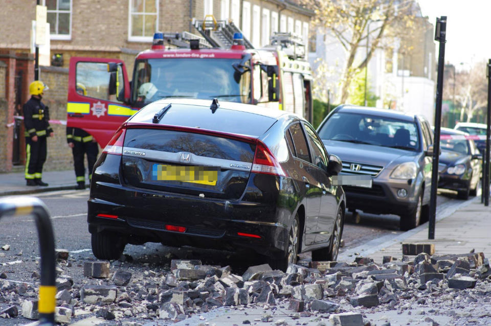 The rubble narrowly missed a mother walking with her baby, and parked cars: @LundunFeeldz