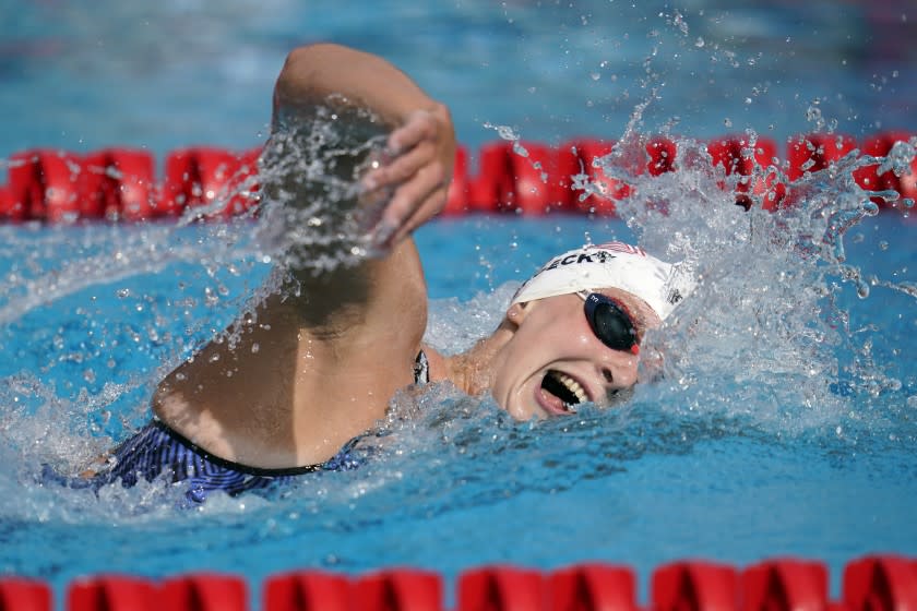 FILE - In this April 11, 2021, file photo, Katie Ledecky competes in the women's 1500-meter freestyle.