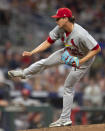St. Louis Cardinals pitcher Giovanni Gallegos watches a throw during the eighth inning of the team's baseball game against the Atlanta Braves on Wednesday, July 6, 2022, in Atlanta. (AP Photo/Edward M. Pio Roda)
