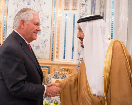 Saudi Arabia's King Salman bin Abdulaziz Al Saud shakes hands with U.S. Secretary of State Rex Tillerson in Jeddah, Saudi Arabia July 12, 2017. Saudi Press Agency/Handout via REUTERS