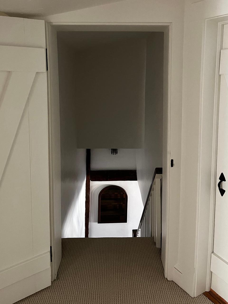 A stairwell in a house, looking down