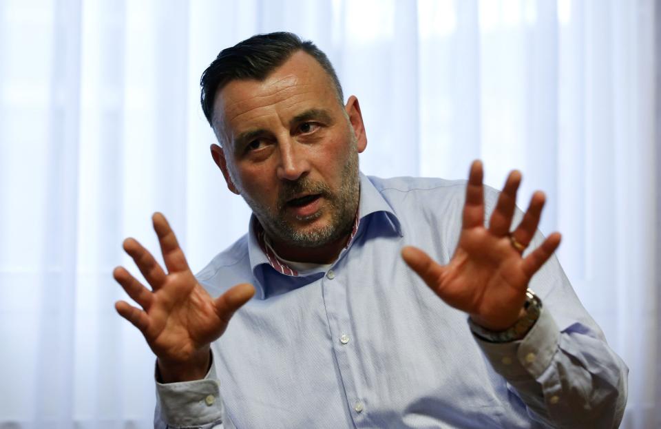 File photo of Lutz Bachmann, co-leader of anti-immigration group PEGIDA, a German abbreviation for "Patriotic Europeans against the Islamization of the West", pictured during a Reuters interview in Dresden January 12, 2015. The leader of the fast-growing German anti-Muslim movement PEGIDA resigned January 2, 2015, after a photo of him posing as Hitler - and reports that he called refugees "scumbags" - prompted prosecutors to investigate him for inciting hatred. REUTERS/Fabrizio Bensch/Files (GERMANY - Tags: CIVIL UNREST POLITICS SOCIETY IMMIGRATION TPX IMAGES OF THE DAY)