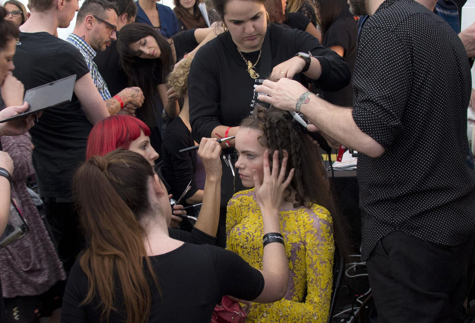 A model is worked on, backstage ahead of the Spring/Summer 2013 Meadham Kirchoff collection at a central London venue, during London Fashion Week, Tuesday, Sept. 18, 2012. (AP Photo/Joel Ryan)