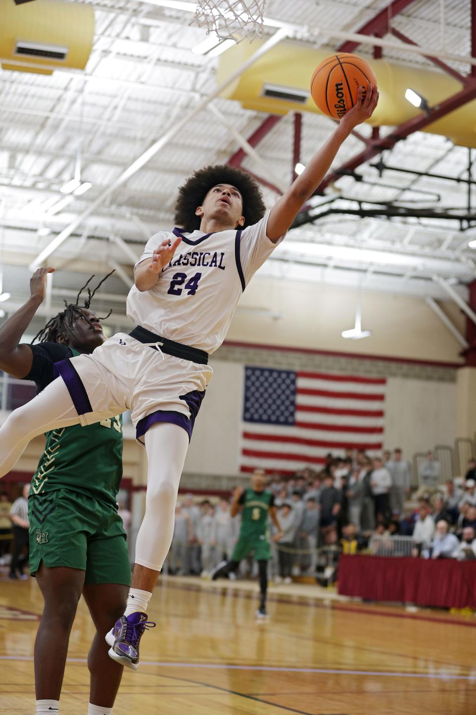 Classical's Eliezer Delbrey goes up for a score against Hendricken in Sunday's Division I Boys Basketball semifinal at Rhode Island College.