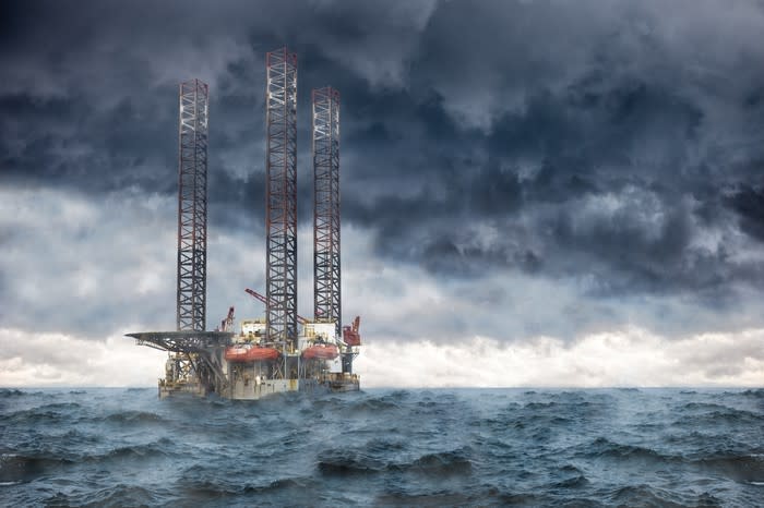 An offshore drilling rig in a storm.