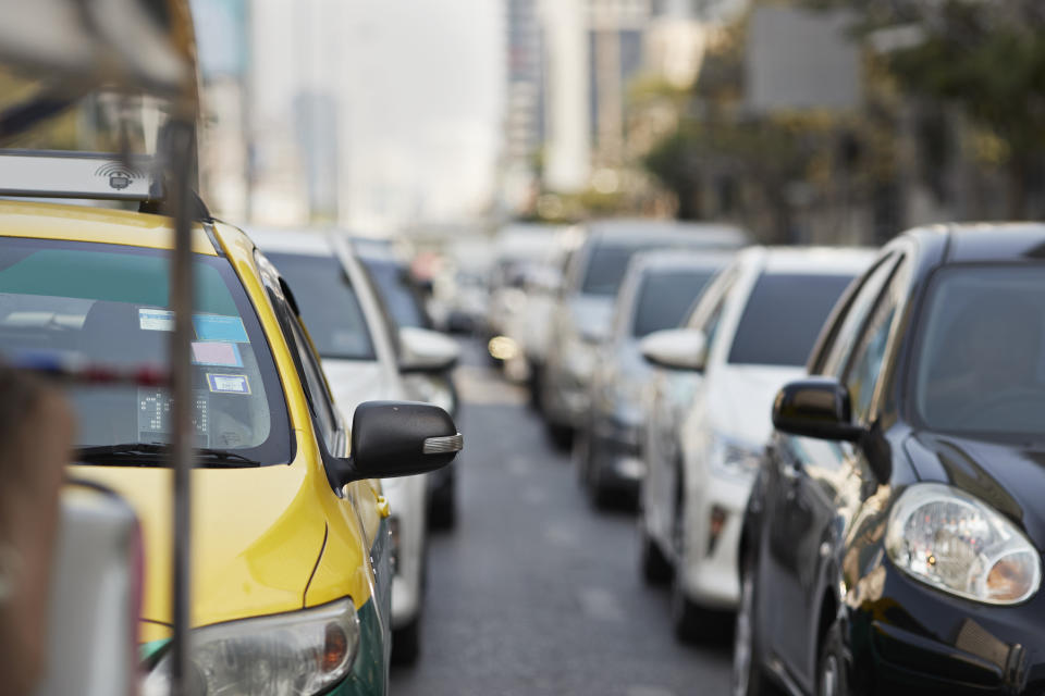 Cars on road in traffic jam during rush hour at city