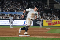 New York Yankees' Jon Berti rounds third base on an RBI single by Juan Soto in the sixth inning of a baseball game against the Miami Marlins, Tuesday, April 9, 2024, in New York. (AP Photo/Peter K. Afriyie)