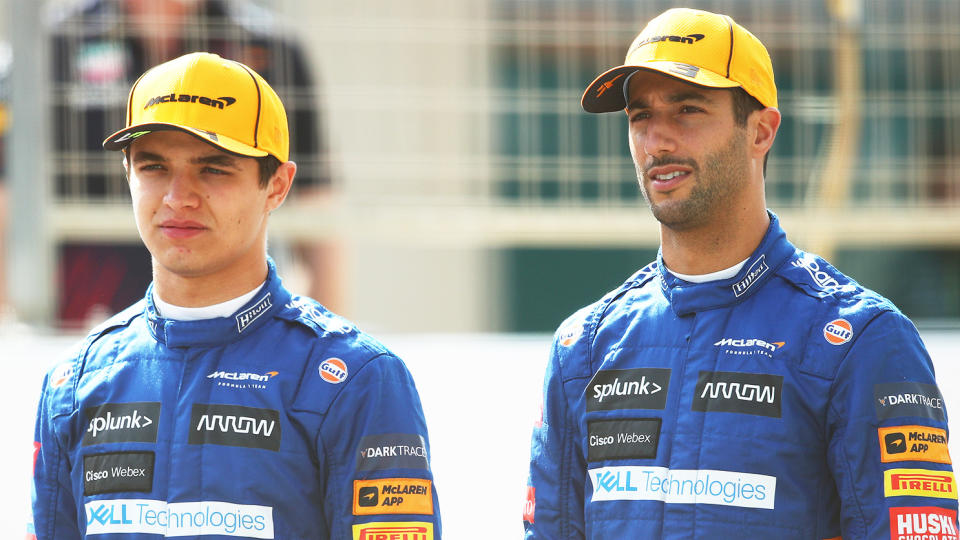 McLaren's Lando Norris (pictured left) standing next to teammate Daniel Ricciardo (pictured right) before the Bahrain GP.